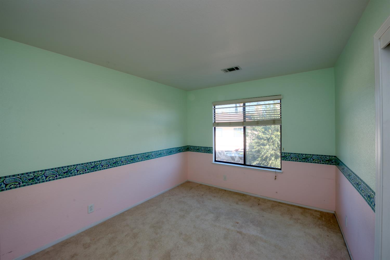 548 Hansen Court Patterson, CA 95363 - Photo 24 of 38 an empty room with a window