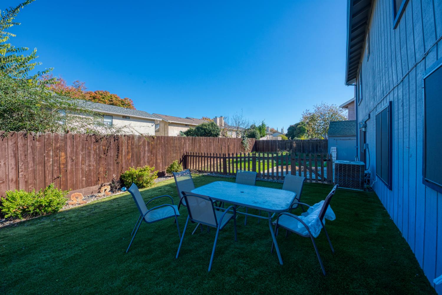 548 Hansen Court Patterson, CA 95363 - Photo 30 of 38 a view of a chair and table in backyard