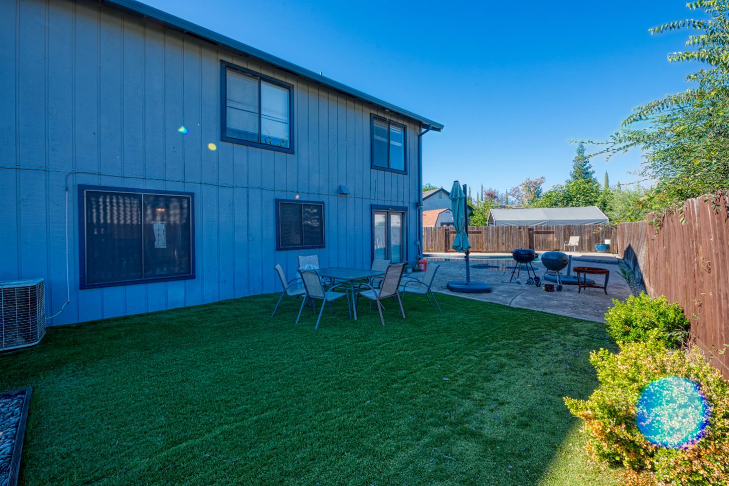 548 Hansen Court Patterson, CA 95363 - Photo 31 of 38 a view of backyard with seating area and green space