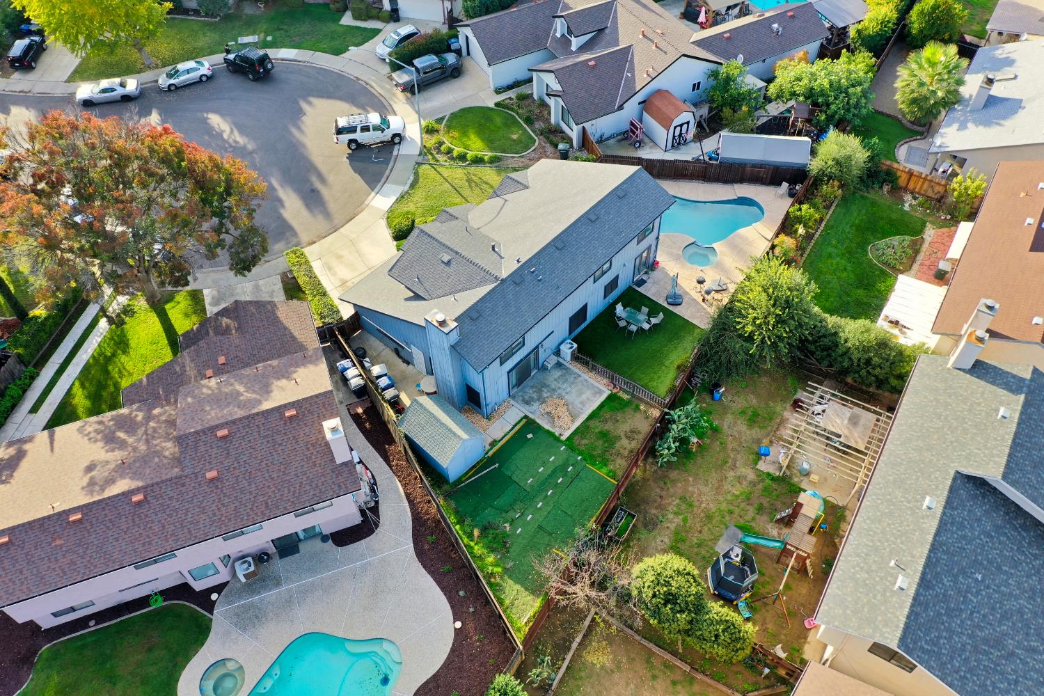 548 Hansen Court Patterson, CA 95363 - Photo 36 of 38 an aerial view of residential house with outdoor space and swimming pool