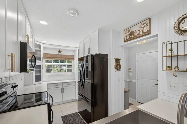 a view of entryway and hall with a rug