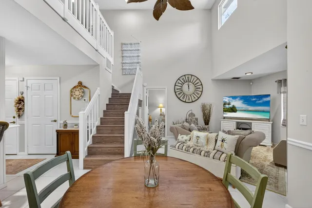 a living room with furniture and a painting on the wall