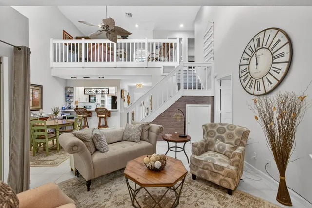 a view of living room and dining room with wooden floor