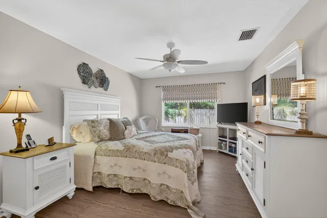 a living room with a rug and a window