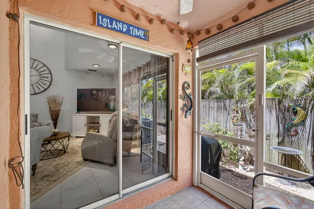 an aerial view of a residential houses with outdoor space and lake view