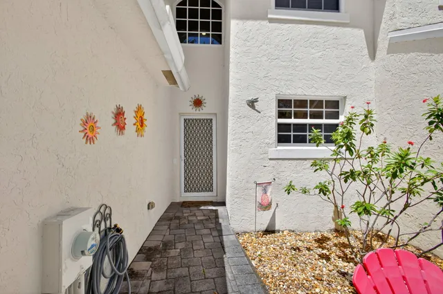 a kitchen with a sink cabinets and appliances