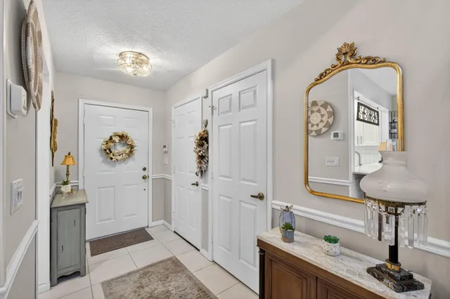 a kitchen with appliances a sink and cabinets