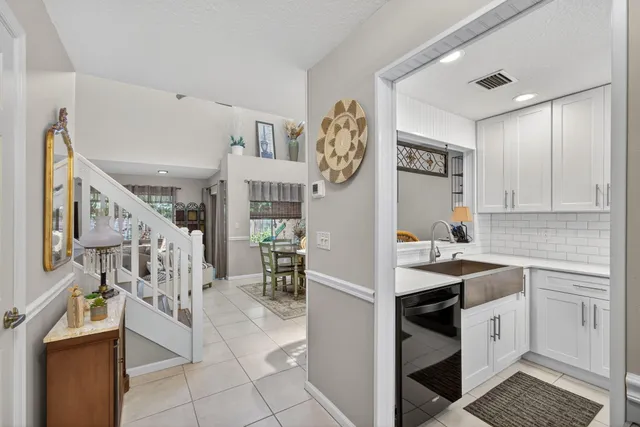 a kitchen with a sink and a stove top oven