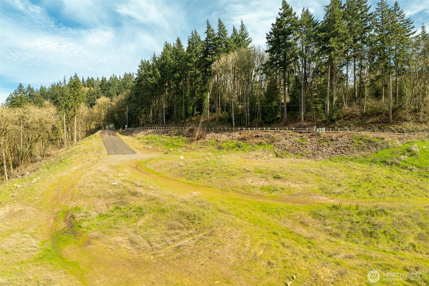 0 Spencer Creek Road, Unit LOT 7 Kalama, WA 98625 - Photo 17 of 37 a swimming pool with trees in the background
