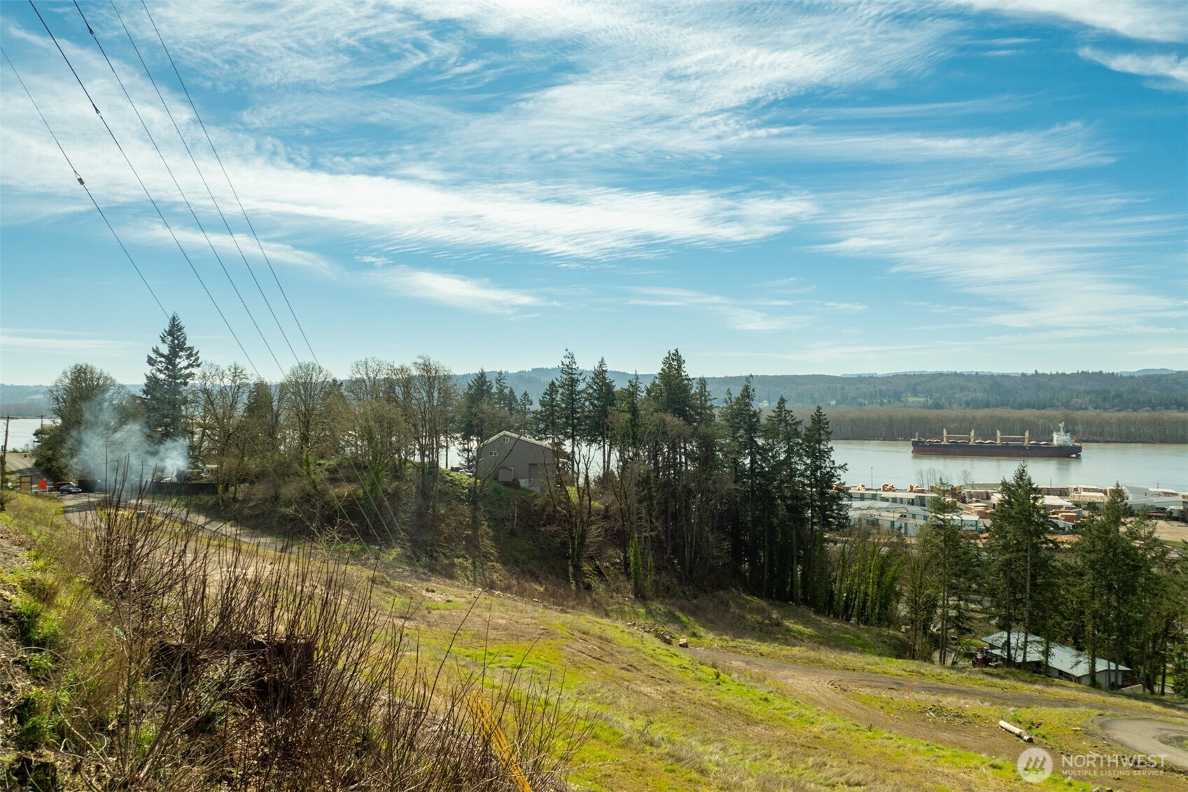 0 Spencer Creek Road, Unit LOT 7 Kalama, WA 98625 - Photo 19 of 37 a view of a lake with a yard