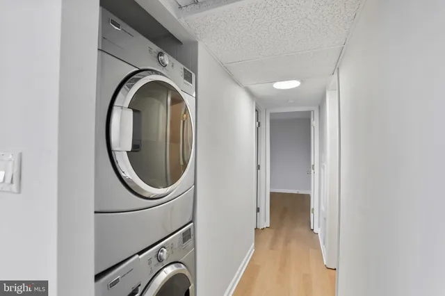 a view of a hallway with washer and dryer