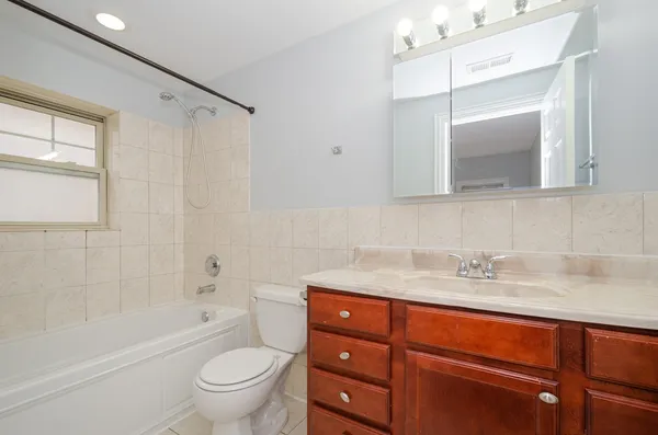 a bathroom with a sink a toilet and a bathtub