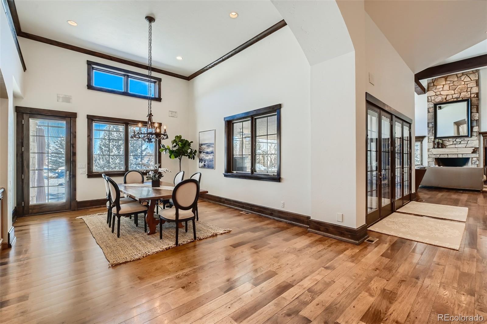 7390 Sagebrush Drive Parker, CO 80138 - Photo 12 of 40 a view of a dining room with furniture window and wooden floor