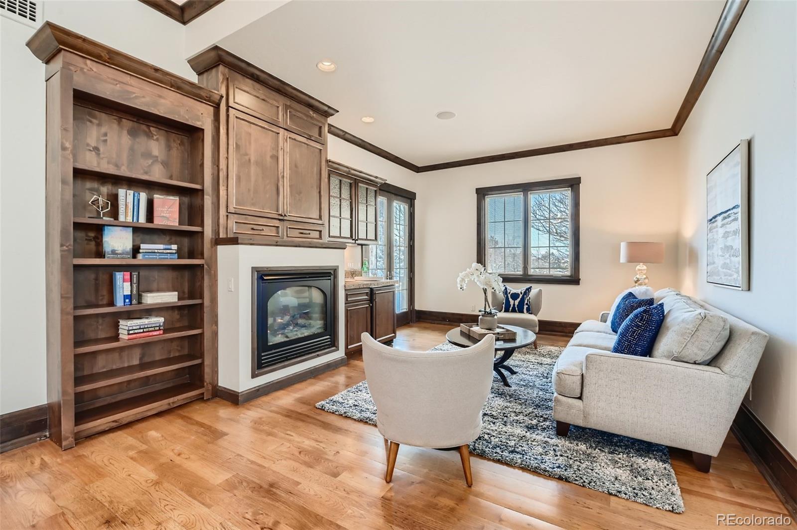 7390 Sagebrush Drive Parker, CO 80138 - Photo 18 of 40 a living room with furniture and a fireplace