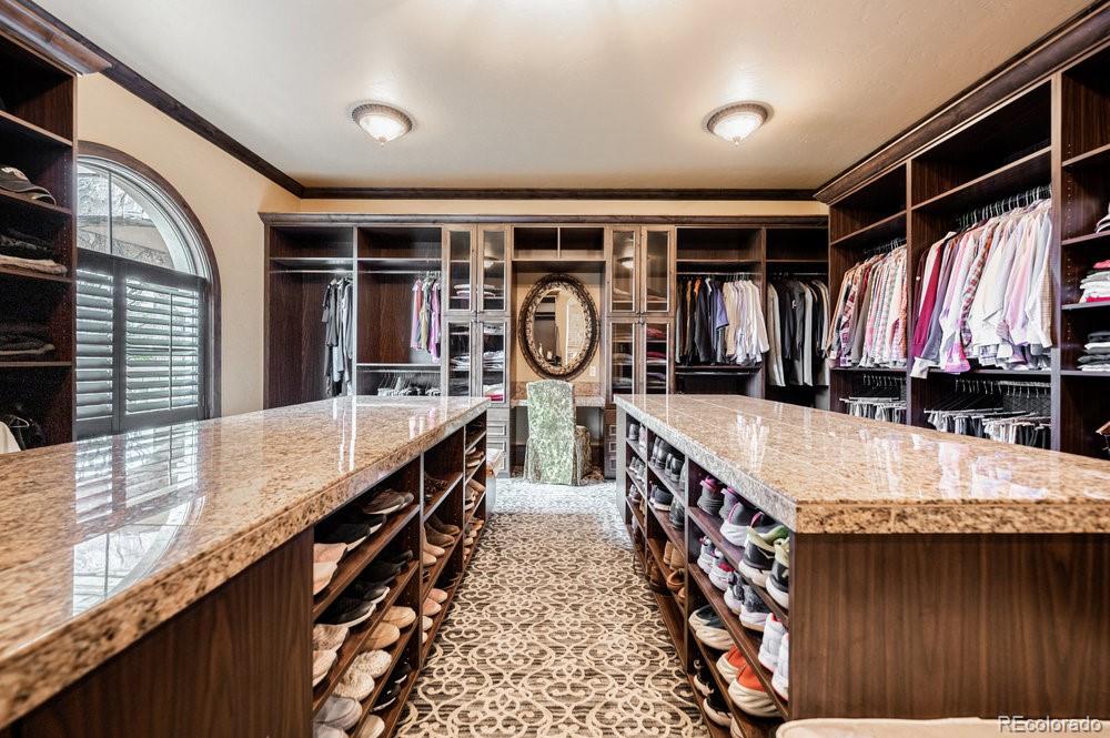 7390 Sagebrush Drive Parker, CO 80138 - Photo 19 of 40 a bathroom with a sink a vanity and a large mirror