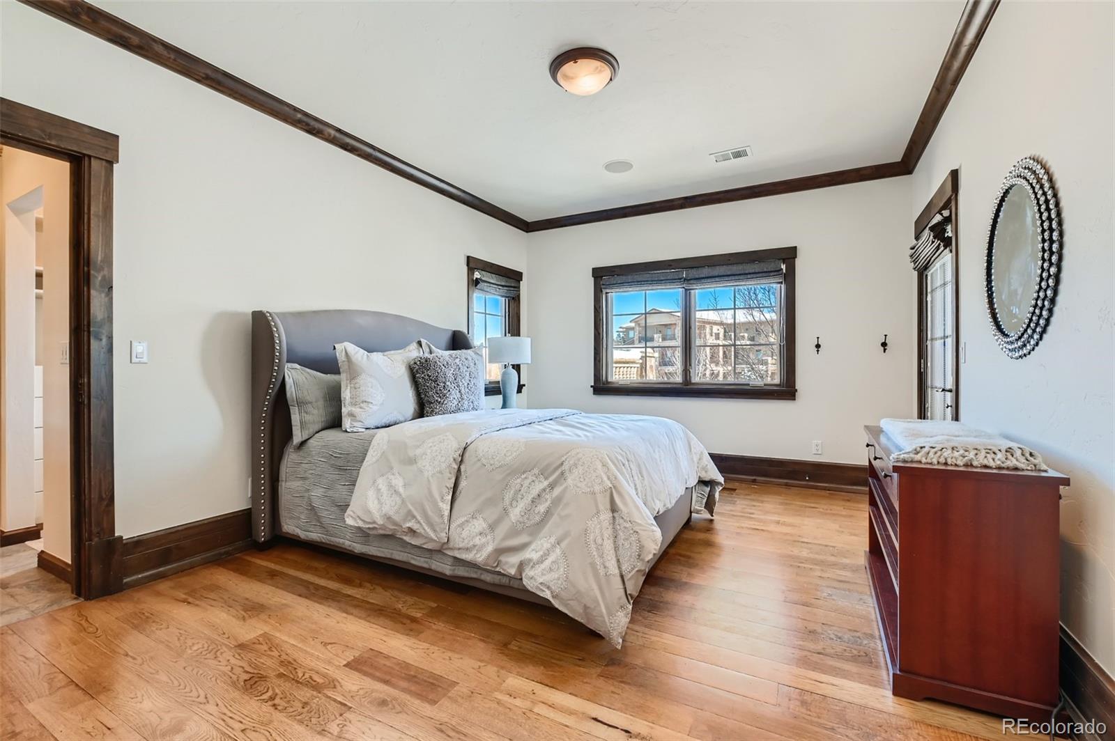 7390 Sagebrush Drive Parker, CO 80138 - Photo 24 of 40 a bedroom with a bed and a window