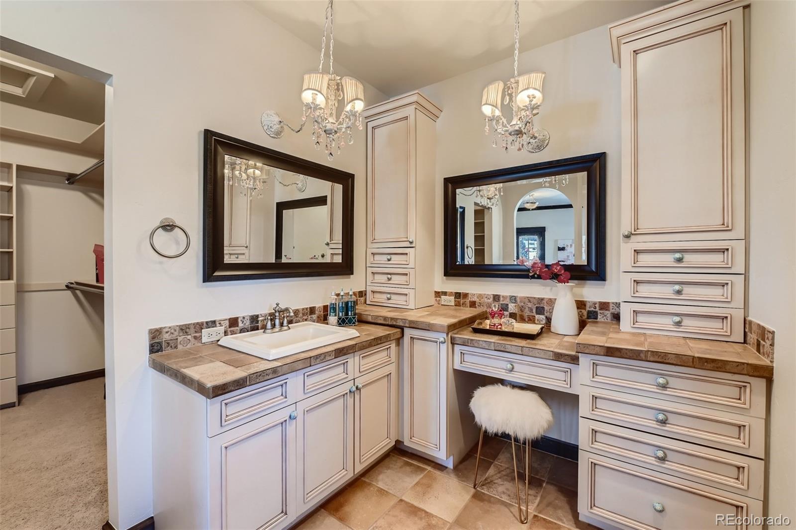 7390 Sagebrush Drive Parker, CO 80138 - Photo 28 of 40 a bathroom with a sink and a mirror