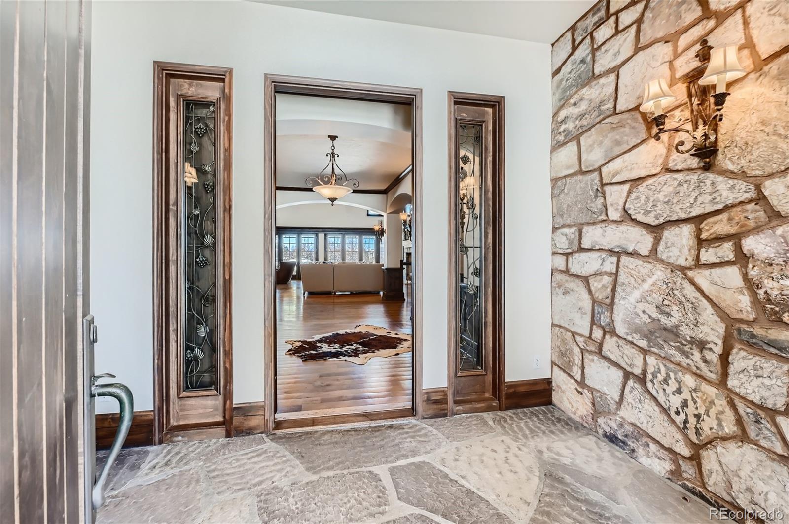 7390 Sagebrush Drive Parker, CO 80138 - Photo 6 of 40 a view of front door with a mirror