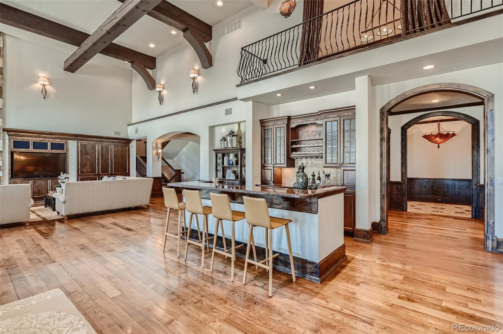 7390 Sagebrush Drive Parker, CO 80138 - Photo 10 of 40 a living room with fireplace furniture and a wooden floor