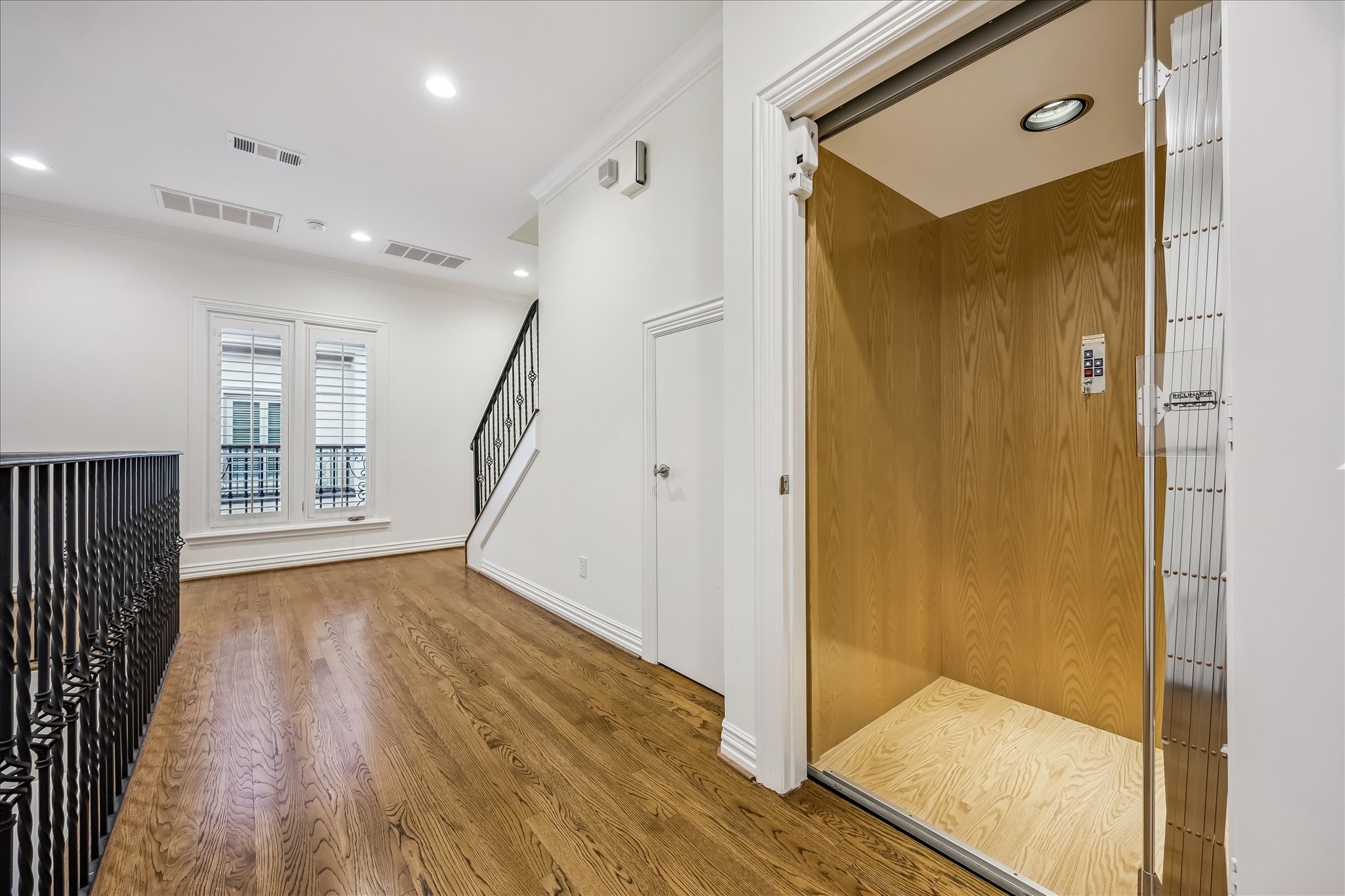 5034 Tangle Lane Houston, TX 77056 - Photo 28 of 50 A private residential elevator serves the first and second floors, adding everyday convenience while providing direct access to the home’s primary bedroom level.