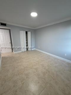 1805 West 56th Street, Unit 412 Hialeah, FL 33012 - Photo 14 of 18 an empty room with window