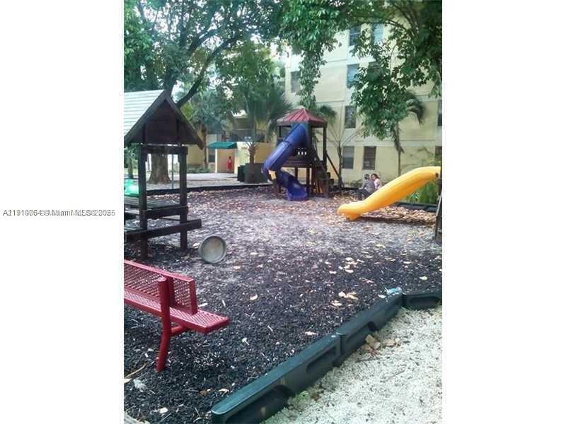 1805 West 56th Street, Unit 412 Hialeah, FL 33012 - Photo 17 of 18 a view of a park with slides