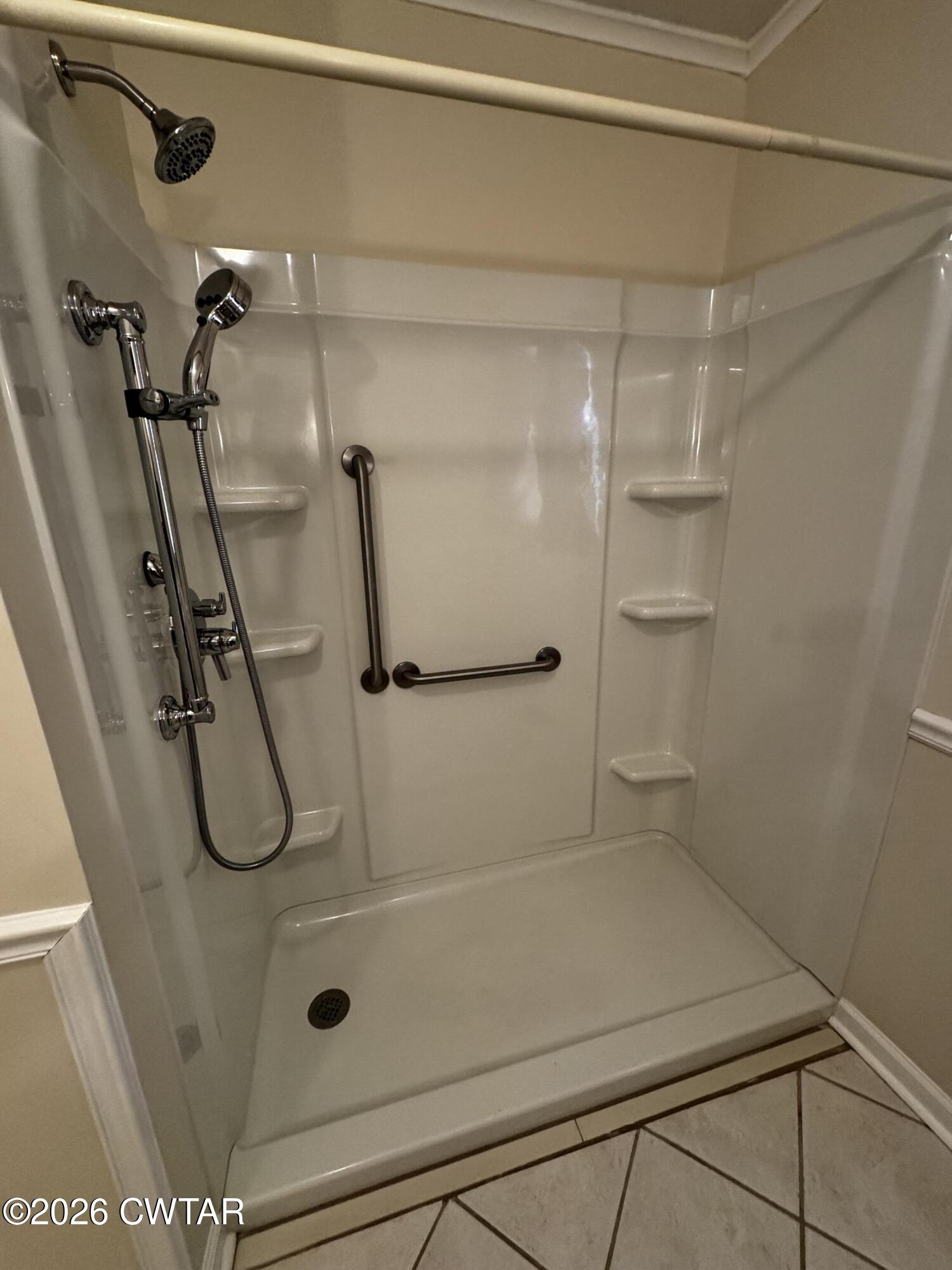 1149 Broad Street Milan, TN 38358 - Photo 11 of 19 a bathroom with a glass shower door