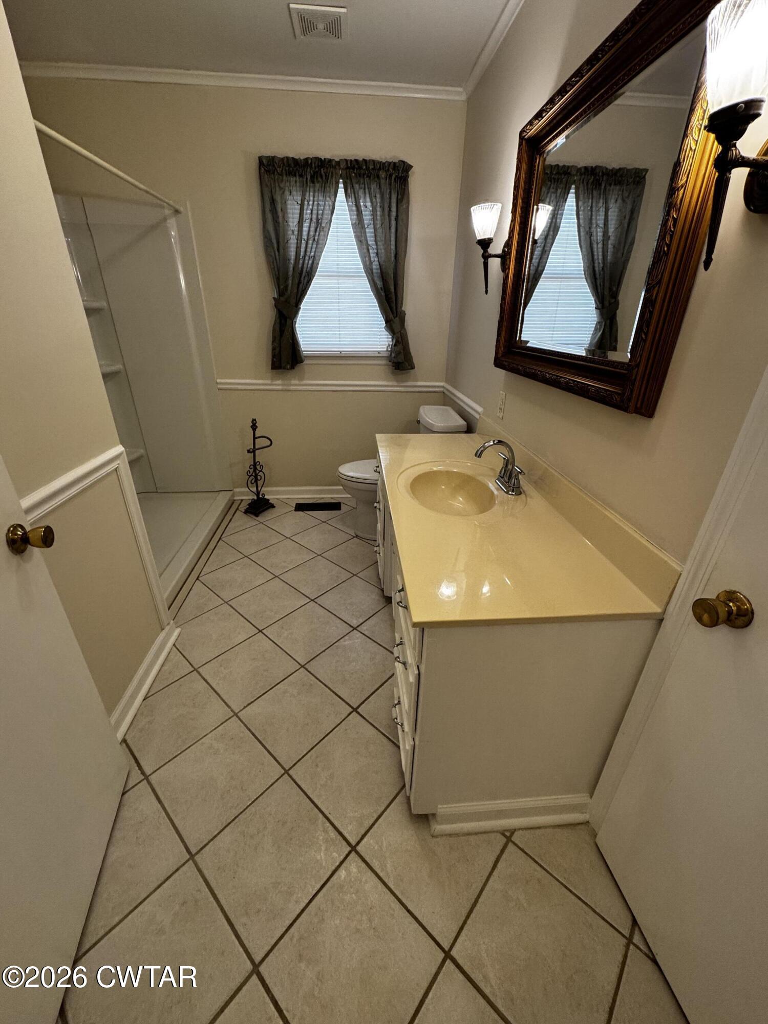 1149 Broad Street Milan, TN 38358 - Photo 12 of 19 a bathroom with a sink and mirror