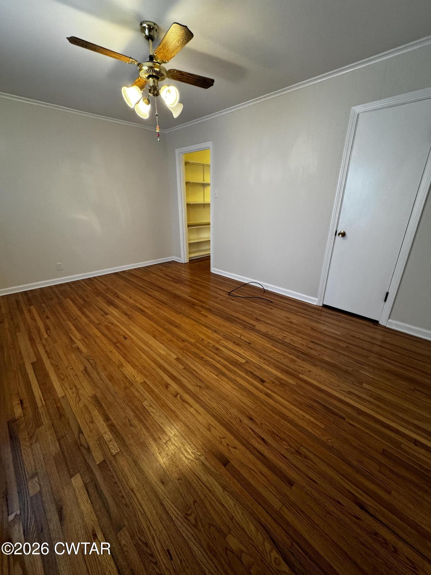 1149 Broad Street Milan, TN 38358 - Photo 16 of 19 a view of empty room with wooden floor