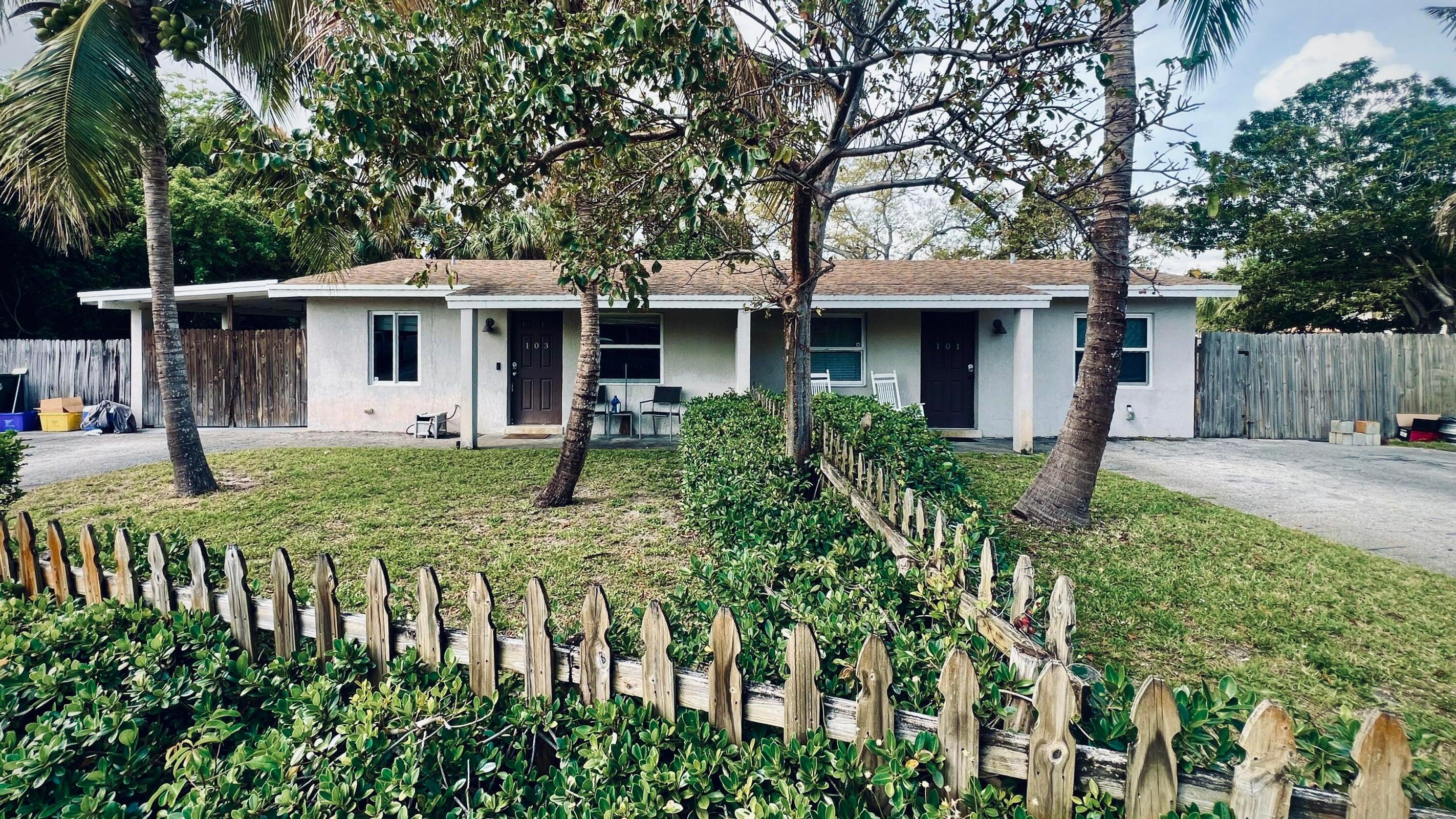 a view of a house with garden and porch