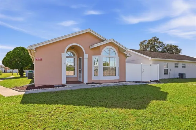 a front view of a house with a yard and porch