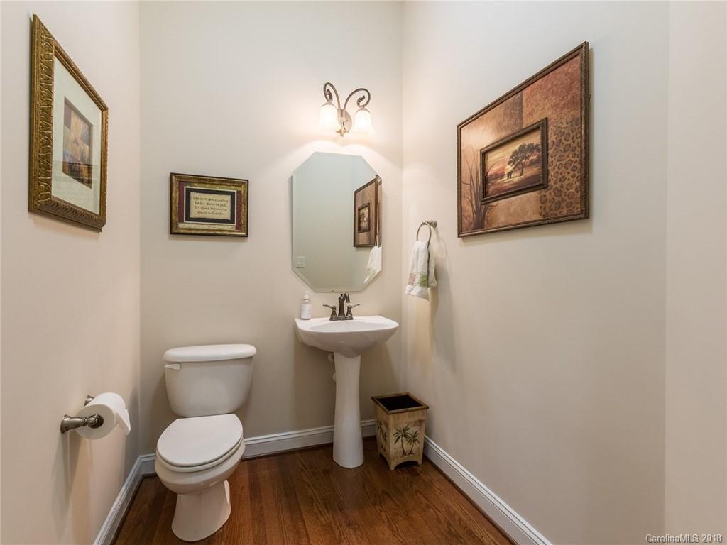 3325 Richard's Crossing Fort Mill, SC 29708 - Photo 18 of 36 a bathroom with a toilet a sink and mirror
