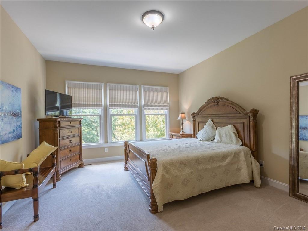 3325 Richard's Crossing Fort Mill, SC 29708 - Photo 21 of 36 a bedroom with a bed chair and fireplace