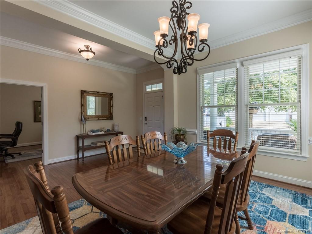 3325 Richard's Crossing Fort Mill, SC 29708 - Photo 7 of 36 a view of a dining room with furniture wooden floor and chandelier