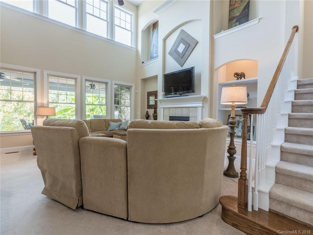3325 Richard's Crossing Fort Mill, SC 29708 - Photo 9 of 36 a living room with furniture a flat screen tv and a fireplace