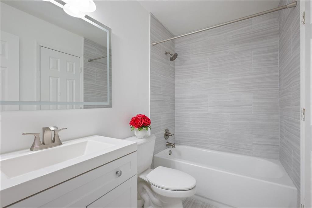 102 Hawkstone Way Alpharetta, GA 30022 - Photo 13 of 22 a bathroom with a sink toilet and shower