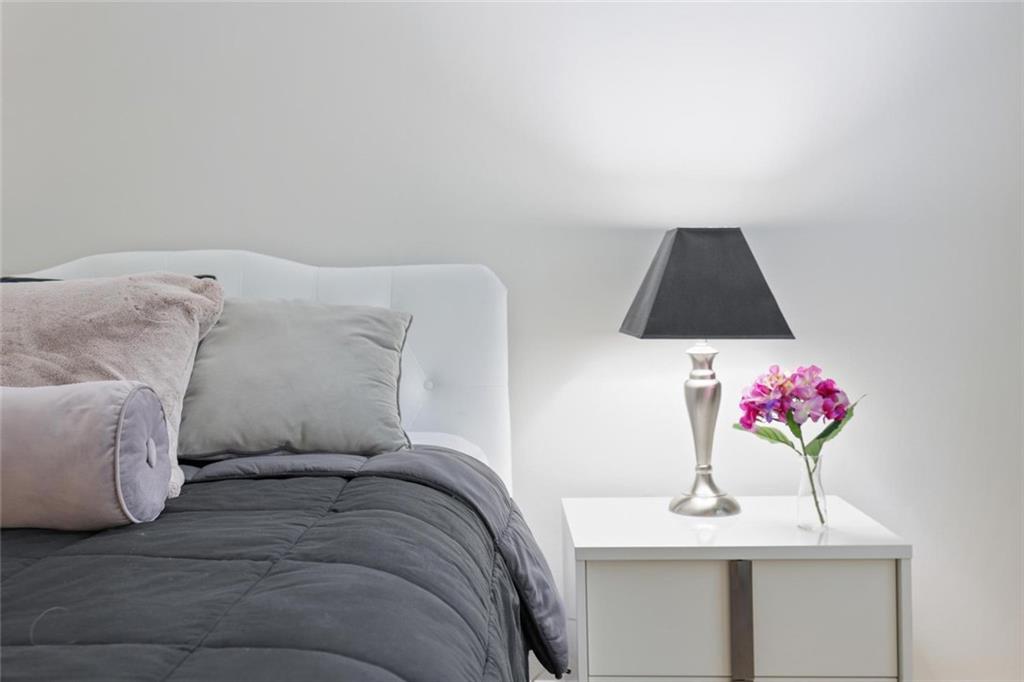 102 Hawkstone Way Alpharetta, GA 30022 - Photo 14 of 22 a bedroom with a bed and a dresser