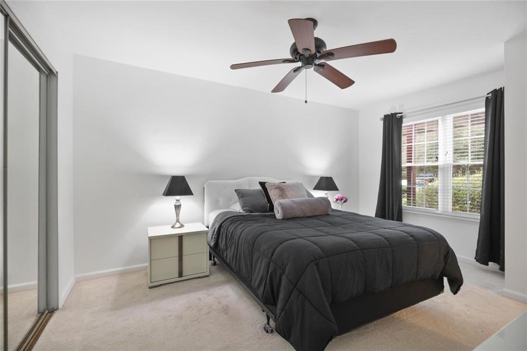 102 Hawkstone Way Alpharetta, GA 30022 - Photo 16 of 22 a bedroom with a bed and window