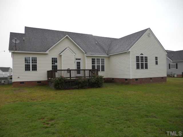 5939 Sandford Road Wilson, NC 27896 - Photo 2 of 10 a view of a house with a yard and a large tree front