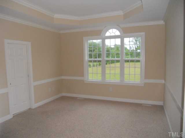 5939 Sandford Road Wilson, NC 27896 - Photo 6 of 10 an empty room with a window