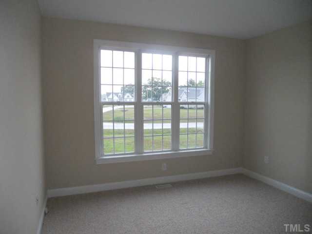 5939 Sandford Road Wilson, NC 27896 - Photo 8 of 10 an empty room with a window