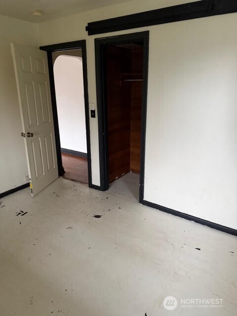 3715 Spokane Street Tacoma, WA 98404 - Photo 13 of 22 a view of a closet and a mirror in a room