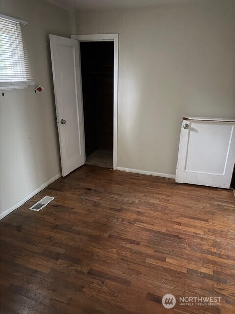 3715 Spokane Street Tacoma, WA 98404 - Photo 15 of 22 an empty room with wooden floor and closet