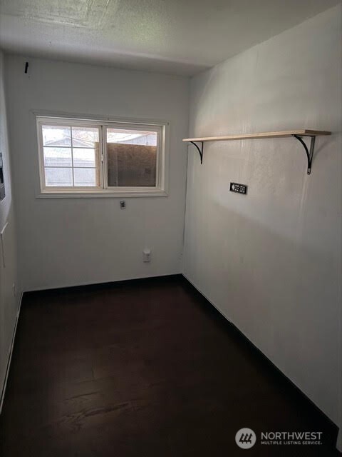 3715 Spokane Street Tacoma, WA 98404 - Photo 21 of 22 a view of a small space with wooden floor and a window