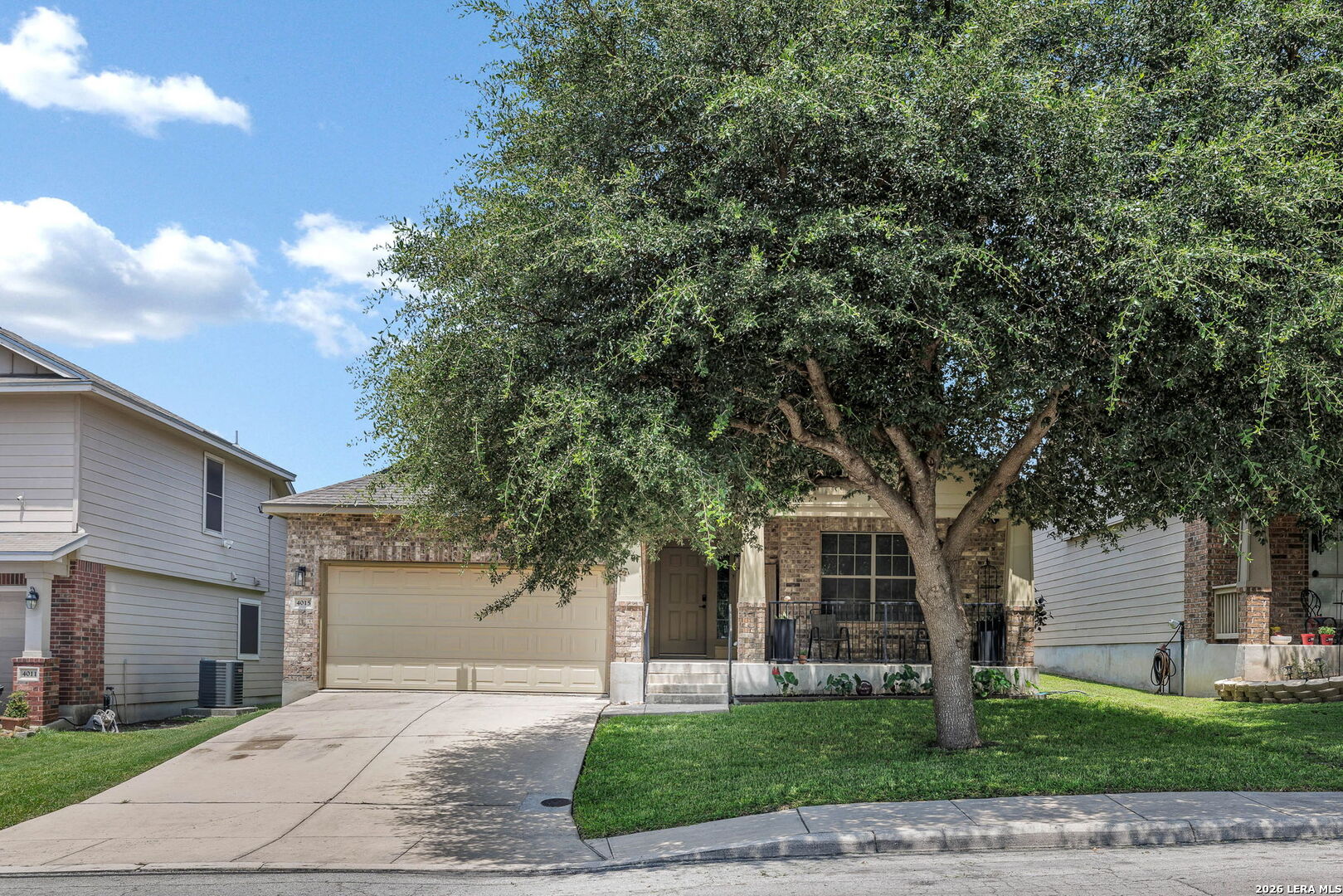 4015 Shervin Way Converse, TX 78109 - Photo 2 of 43 a front view of a house with a garden and trees