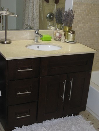 73 Walnut Avenue, Unit 3 Boston, MA 02119 - Photo 13 of 19 a bathroom with a sink and a mirror