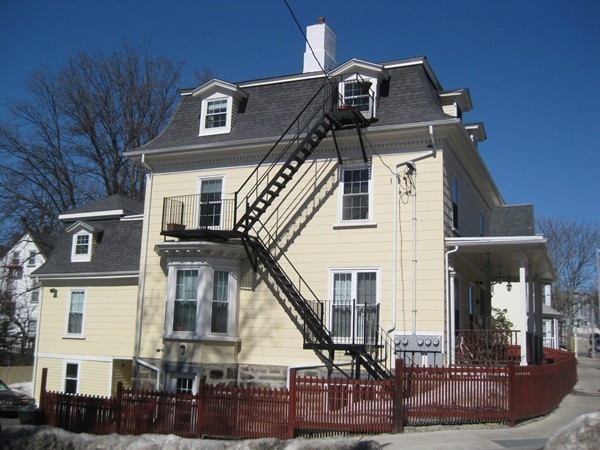 73 Walnut Avenue, Unit 3 Boston, MA 02119 - Photo 3 of 19 a front view of a house with a front door
