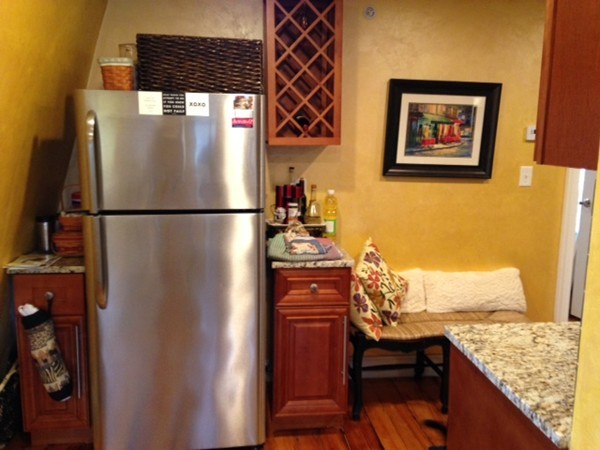 73 Walnut Avenue, Unit 3 Boston, MA 02119 - Photo 6 of 19 a white refrigerator freezer sitting inside of a kitchen