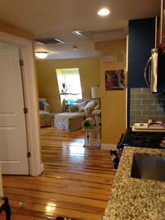 73 Walnut Avenue, Unit 3 Boston, MA 02119 - Photo 7 of 19 a living room with furniture and a flat screen tv