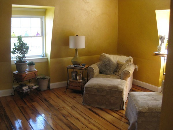 73 Walnut Avenue, Unit 3 Boston, MA 02119 - Photo 9 of 19 a bedroom with a bed and wooden floor